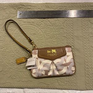 Coach Signature Cream Multi Madison Mini Graphic wristlet.